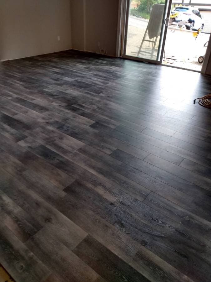 picture of a newly installed wooden floor installed by a handyman